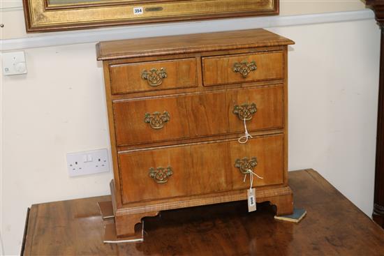 A small walnut chest W.58cm